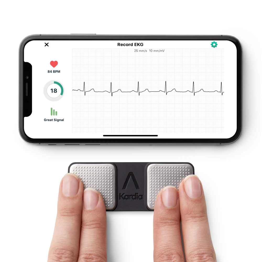 fingers on a KardiaMobile taking an EKG with the Kardia app